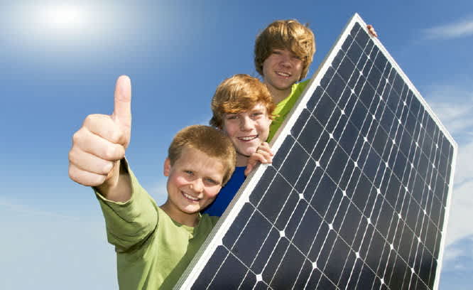 Happy boys with PV panel